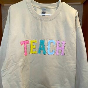 “teach” crewneck
